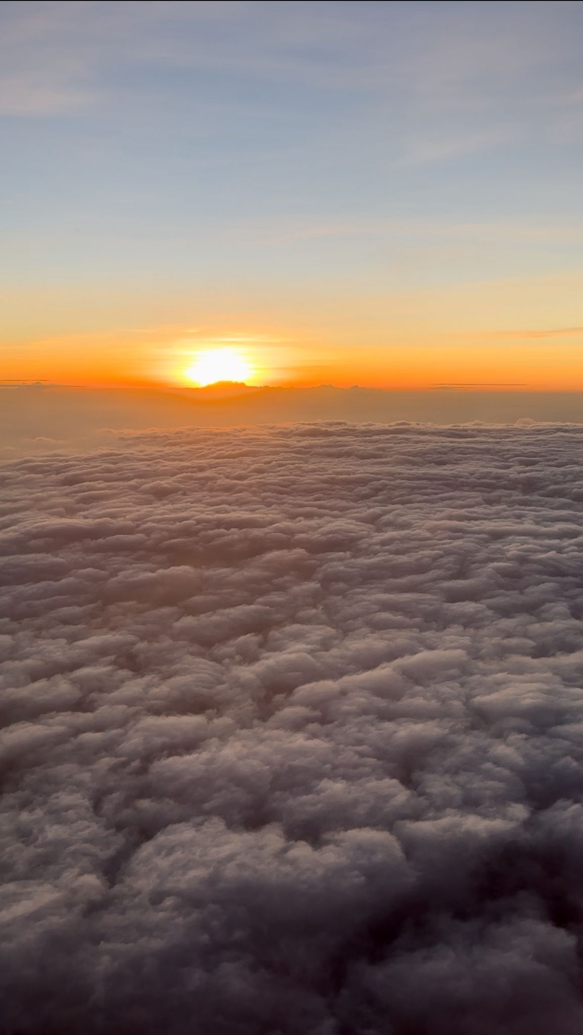 Golden morning light filtering through clouds